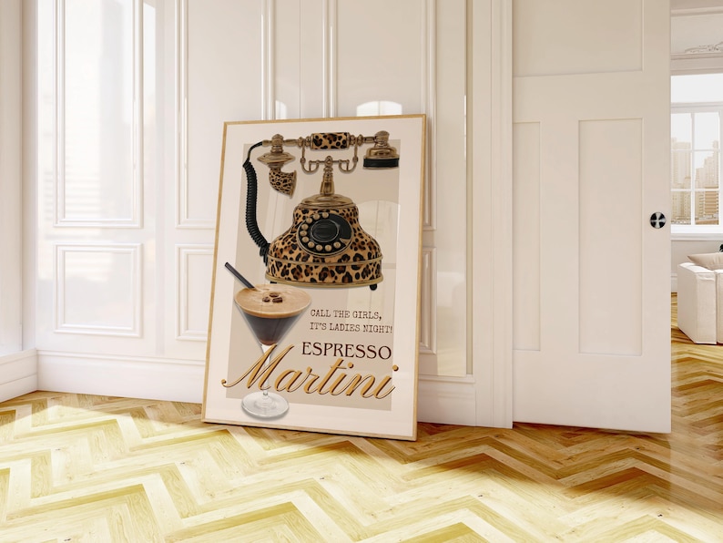 May include: A framed print featuring a vintage telephone with a leopard print design. The print also includes an espresso martini illustration and the words "Call the girls, it's ladies night! Espresso Martini."