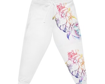 May include: White sweatpants with a colorful anatomical heart design on each leg. The heart is outlined in black and filled with a gradient of pink, orange, yellow, green, blue, and purple.