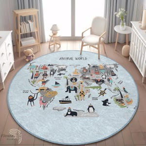 May include: A round, light blue rug with a world map design and the text "ANIMAL WORLD". The map features illustrations of animals and continents. The rug is approximately 60 inches in diameter.