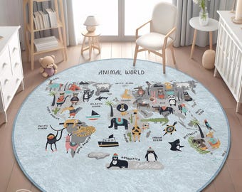 May include: A round, light blue rug with a world map design and the text "ANIMAL WORLD". The map features illustrations of animals and continents. The rug is approximately 60 inches in diameter.