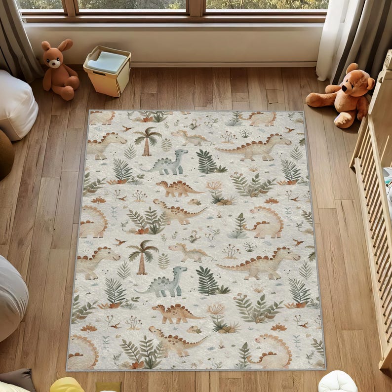 May include: A rectangular area rug with a repeating pattern of dinosaurs, palm trees, and foliage in shades of beige, tan, and green. The rug is placed on a wooden floor in a room with a window and children's toys.