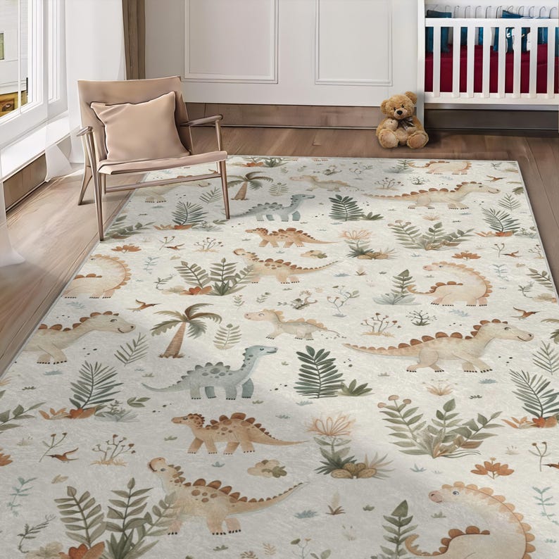 May include: A rectangular area rug with a repeating pattern of various dinosaurs in shades of tan, green, and blue on a cream background. The rug also features illustrations of plants and palm trees, creating a playful, whimsical design.