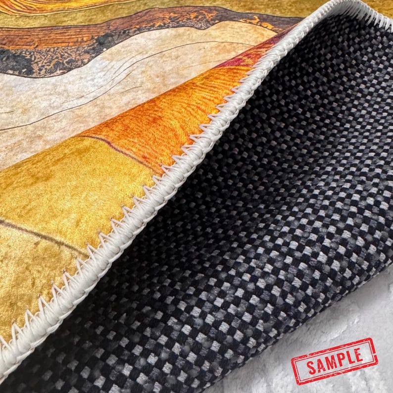 a close-up view of a rug with a black and white checkered pattern. The rug appears to be made of a woven material, and there is a sample of the rug visible in the bottom right corner of the image.