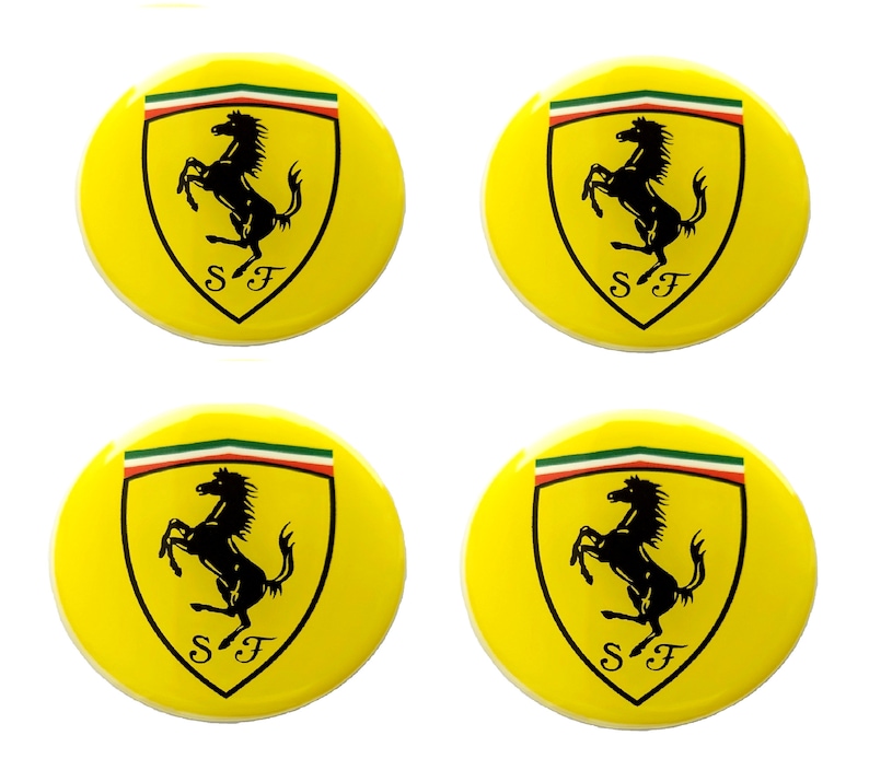 May include: Four yellow circular buttons featuring the Ferrari logo. Each button has a yellow background with the Ferrari shield, a black prancing horse, and the letters "SF" below. The shield is topped with green, white, and red stripes.