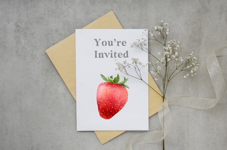 May include: A white card with the text "You're Invited" and a watercolor illustration of a red strawberry.