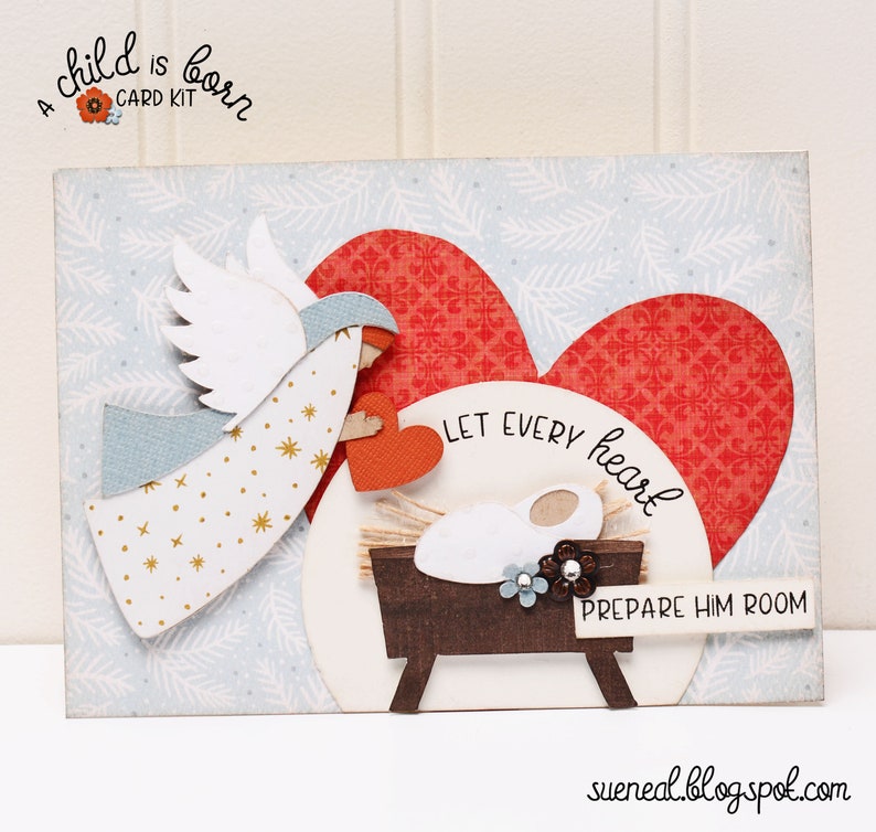 May include: A Christmas card kit with a white angel holding a red heart, a baby in a manger, and the text "Let every heart prepare him room".