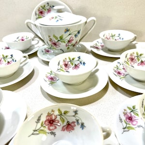 CP Limoges Set with Sugar Bowl, 10 Cups, and 12 Saucers in a Classic Design