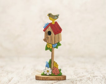 Whimsical Wooden Birdhouse with Spring Flowers and Perched Bird - Charming Garden Decor