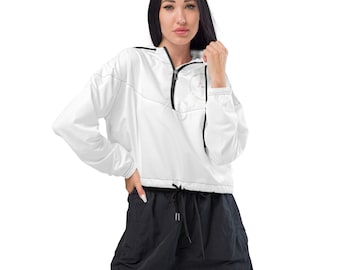 May include: A white long-sleeve windbreaker jacket featuring a black quarter-zip front closure, a hood, and a circular graphic on the chest. The jacket has a drawstring hem and black contrast stitching details throughout the garment.