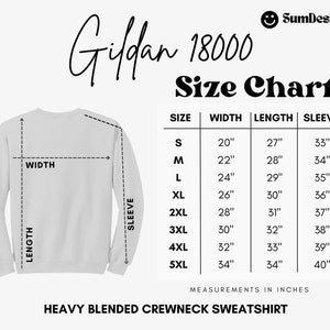 May include: White heavy blended crewneck sweatshirt with a size chart. The chart shows measurements in inches for width, length, and sleeve length, ranging from size S to 5XL. The brand name is Gildan 18000.