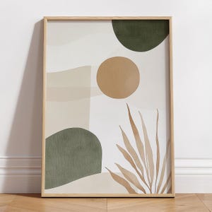 May include: Abstract art print with a brown, green, and beige color scheme. The print features a large circle, a smaller circle, and a leaf-like shape.
