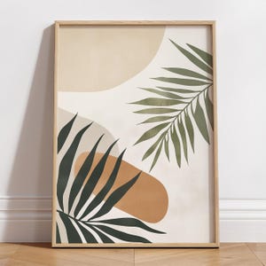 May include: Abstract art print with a white background, featuring two green palm leaves and abstract shapes in beige and orange.