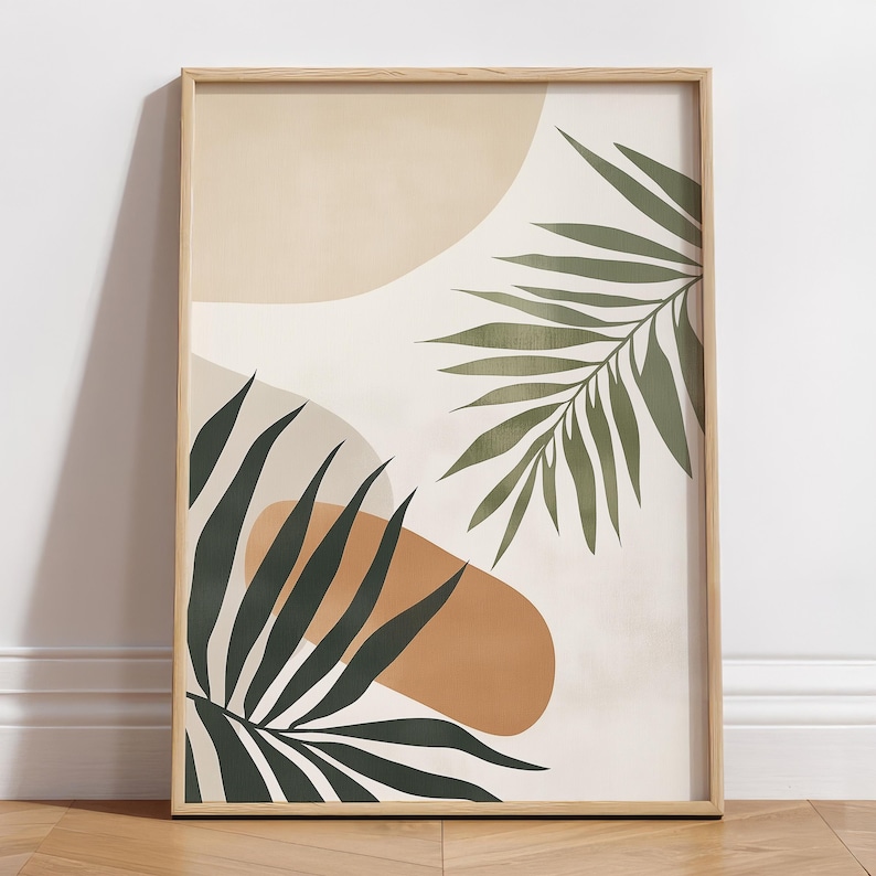 May include: Abstract art print with a white background, featuring two green palm leaves and abstract shapes in beige and orange.