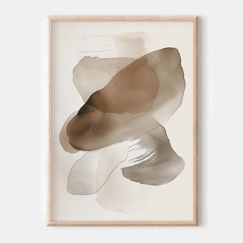 Puede incluir: Impresi&oacute;n de arte abstracto con formas de acuarela marrones y beige sobre un fondo blanco. La impresi&oacute;n est&aacute; enmarcada en un marco de madera claro.