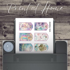 May include: Printable journal tags featuring a whimsical watercolor design with a castle, stars, and a unicorn. The tags are labeled "Journal Tags" and are ready to be printed at home.