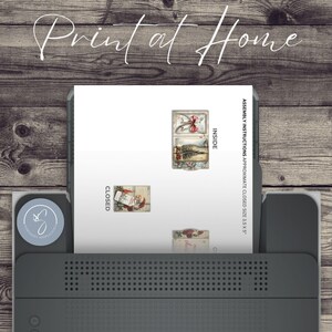 May include: A printer is shown printing a sheet with Christmas-themed images and text. The text "Print at Home" is at the top. The printed sheet includes images labelled "Inside" and "Closed", with assembly instructions.