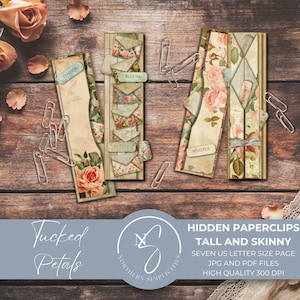 Puede incluir: Tres portapapeles de estilo vintage con diseños florales y de sobres, dispuestos sobre una superficie de madera rústica. Los portapapeles presentan rosas, elementos botánicos y las palabras "Tender", "Bloom", "Petals" y "Whisper". También se ve el texto "Tucked Petals" y "Hidden Paperclips".