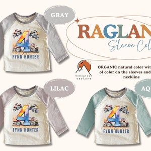 May include: A white long-sleeved shirt with a colorful number four and monster truck graphic. The shirt has a gray raglan sleeve and the text "FYNN HUNTER" is printed below the graphic.