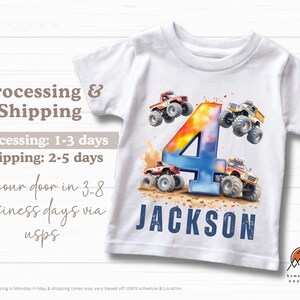 May include: White t-shirt with a colorful number four and monster trucks. The name "JACKSON" is printed in blue below the number.
