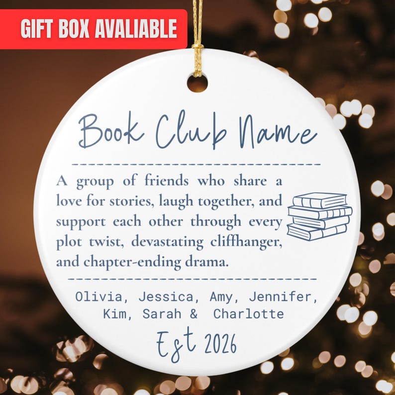 May include: A round white ceramic ornament with a gold hanging string. The text reads Book Club Name, followed by a description of friends sharing stories, a stack of books illustration, names Olivia, Jessica, Amy, Jennifer, Kim, Sarah & Charlotte, and Est 2026.