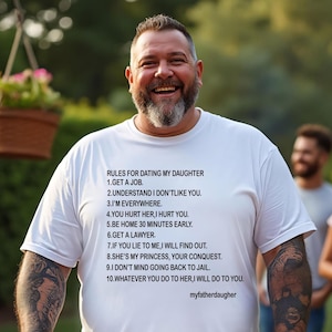 May include: A white t-shirt with black text listing rules for dating a daughter. The text includes phrases like "Get a job" and "I'm everywhere." The shirt also has the text "myfatherdaughter" at the bottom.