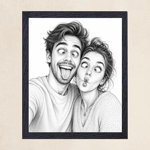 May include: A black and white pencil sketch style portrait of two people making silly faces, with one person sticking their tongue out and the other making a fish face, enclosed in a dark textured rectangular frame against a light background.