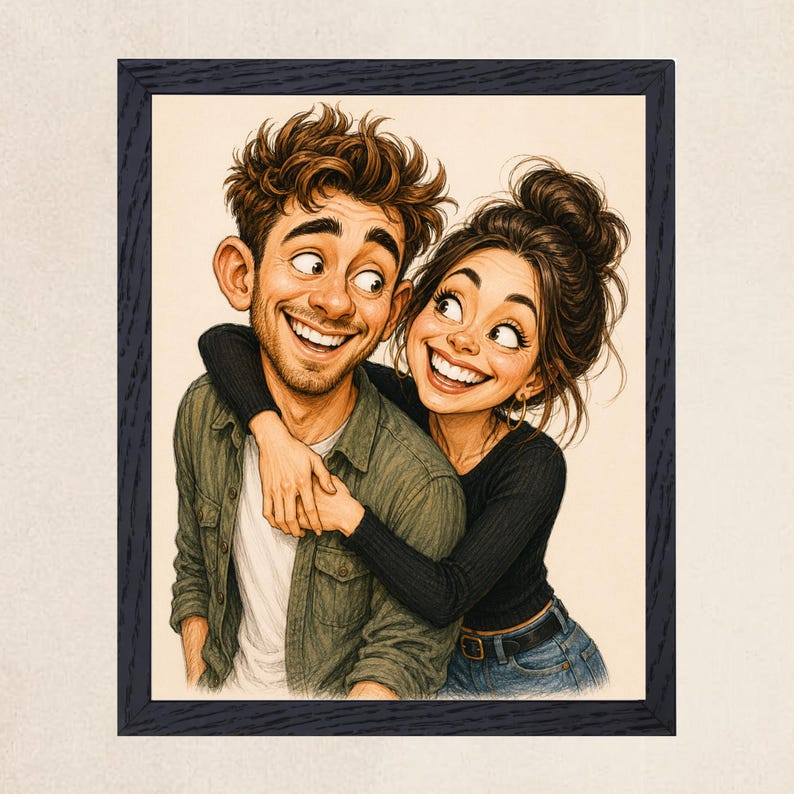 May include: A framed cartoon illustration of two people smiling. One person has short brown hair, a white shirt, and an olive green button-down shirt. The other person has dark hair in a bun, a black long-sleeve shirt, and blue jeans, embracing the first person.