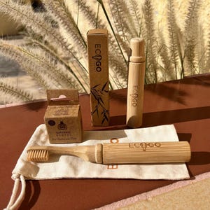 EcoGoTravel Dental Kit: Bamboo Travel Toothbrush, Toothpaste Tablets, and Cotton Storage Bag