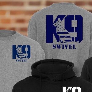 May include: Four sweatshirts and hoodies in gray and black. Each garment features a K9 design with an American flag motif and the word "SWIVEL". The sweatshirts are crew neck, while the hoodies have a drawstring hood.