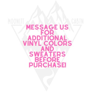 May include: Pink text on a white background with a mountain graphic. The text reads "Message us for additional vinyl colors and sweaters before purchase!"  The words "moonlit" and "cabin" are at the top of the graphic.