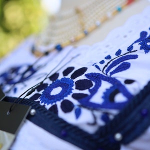 Beautiful traditional blouse from Ecuador. Hand embroidered with brilliant blue-colored threads. One size. unique design.