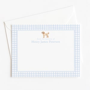 May include: A light blue gingham stationery card with a matching envelope. The card features a watercolor illustration of a dog and the text "from the nursery of Henry James Peterson."