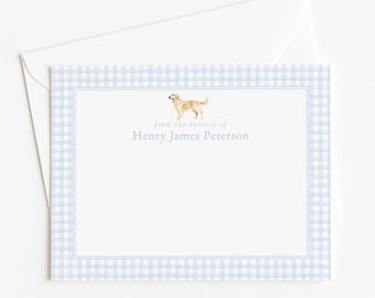 May include: A rectangular stationery card with a light blue and white gingham border. The center features a small illustration of a golden dog above the text "from the nursery of Henry James Peterson" in light blue font, paired with a white envelope.