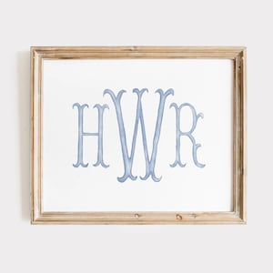 May include: A framed print featuring the monogram "HWR" in a light blue watercolor style. The letters are elegantly designed with decorative flourishes. The frame is a light brown color, adding a classic touch to the artwork.