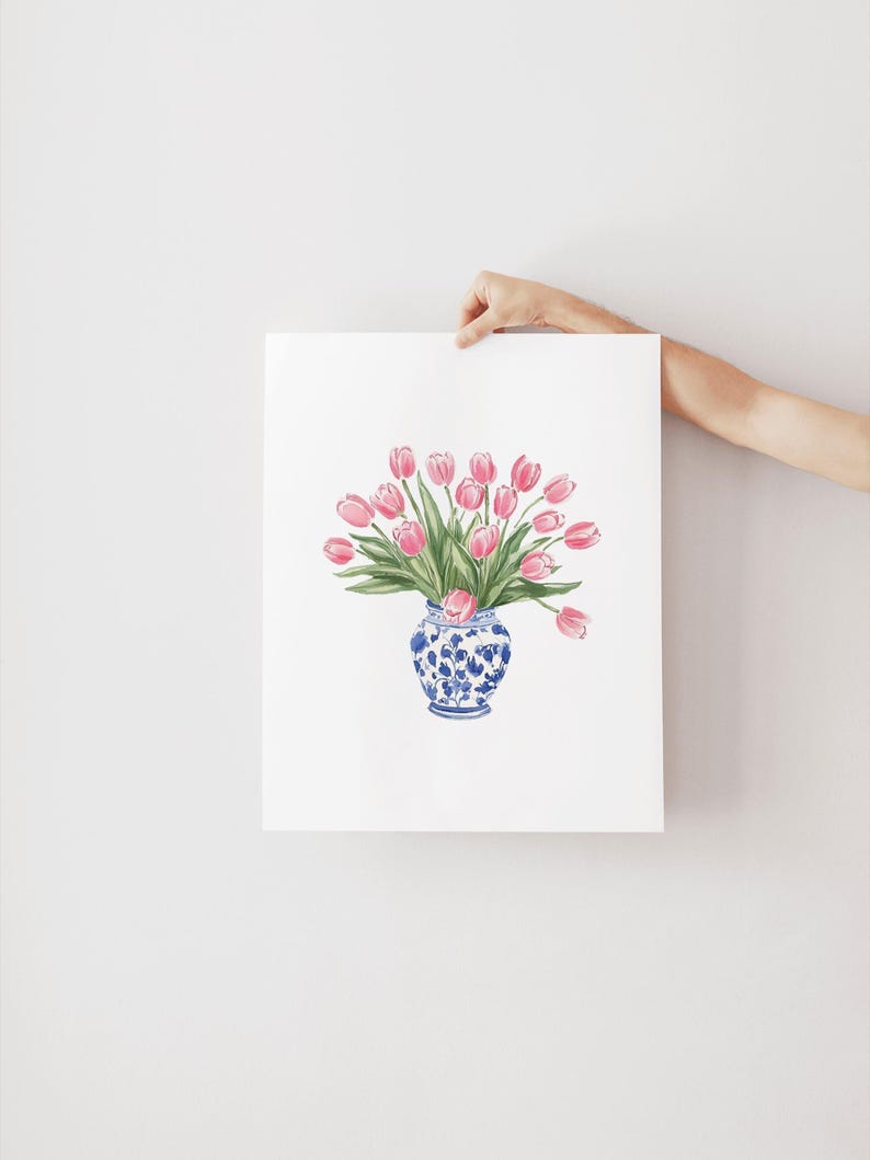 May include: A watercolor painting of a bouquet of pink tulips in a blue and white porcelain vase.