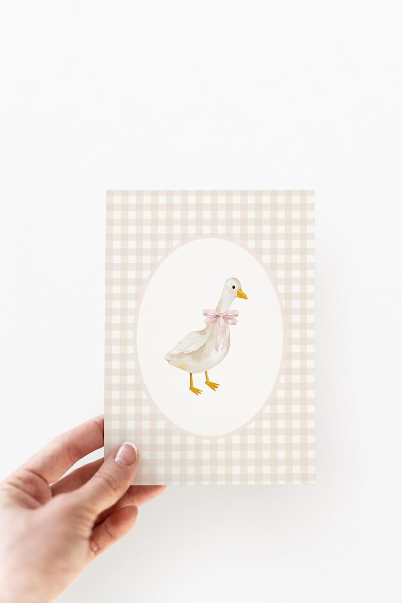 May include: A white goose with a pink bow is illustrated on a beige and white gingham background. The goose is standing on a white oval.