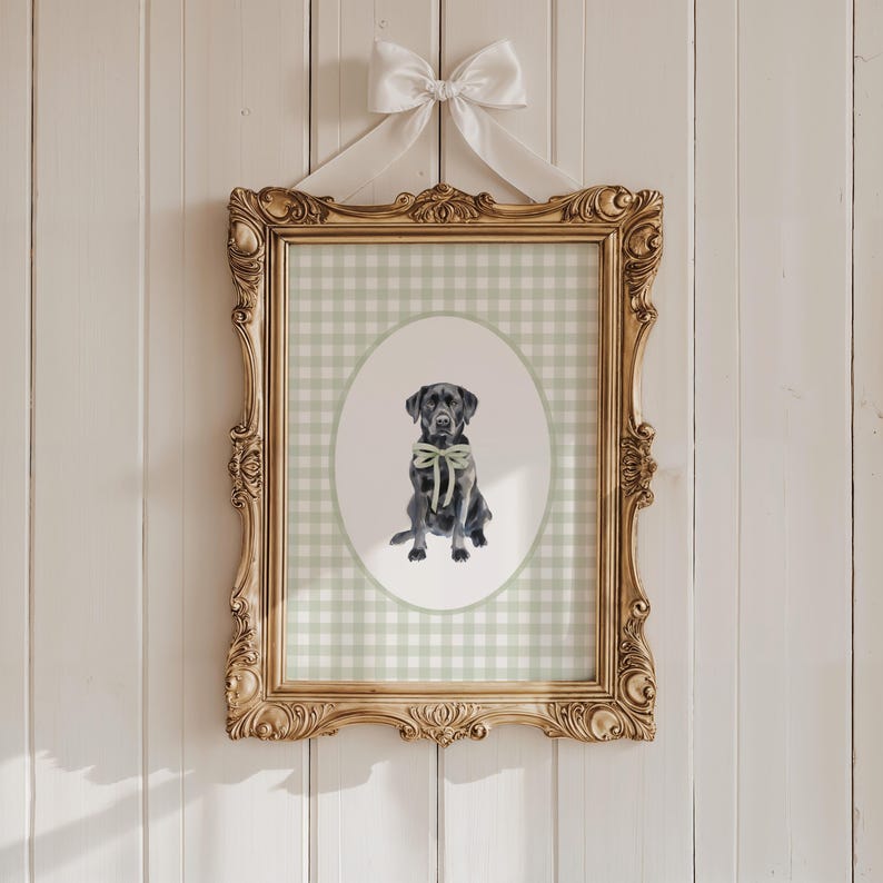 May include: A framed print of a black Labrador Retriever wearing a green bow tie. The print is on a green and white gingham background.