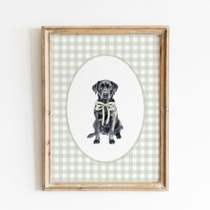May include: A framed print of a black Labrador Retriever wearing a green bow tie. The print is on a green and white gingham background.