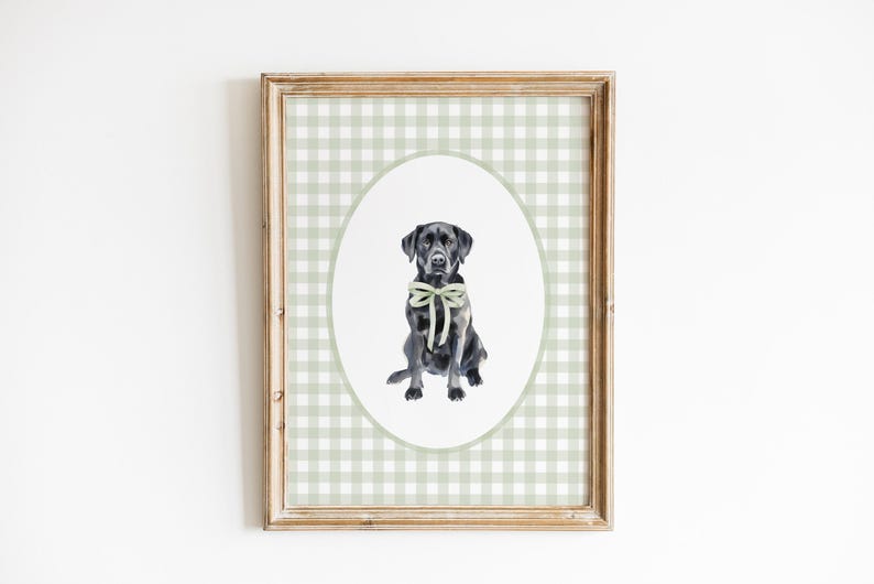 May include: A framed print of a black Labrador Retriever wearing a green bow tie. The print is on a green and white gingham background.