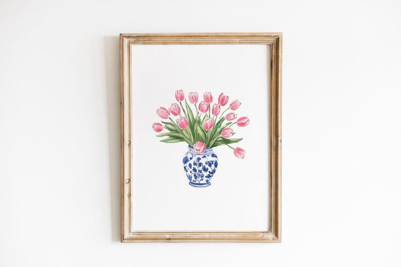 May include: A watercolor painting of a bouquet of pink tulips in a blue and white porcelain vase. The vase has a floral pattern and is sitting on a white background.