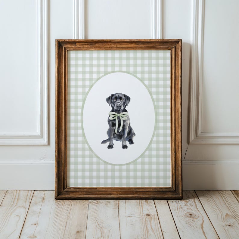 May include: A framed print of a black Labrador Retriever wearing a green bow tie. The print is on a green and white gingham background.