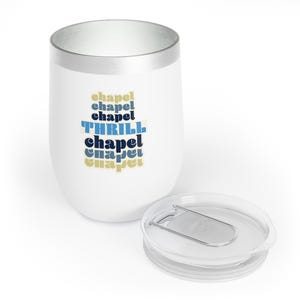 May include: White stainless steel travel mug with a silver lid and a blue and yellow graphic that says "chapel THRILL chapel chapel chapel".