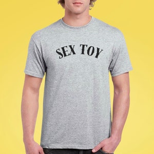 Sex Toy T-Shirt - Bold Pride Apparel - LGBTQ+ Humor Tee - Gay Statement Shirt - Sassy Parade Clothing - Funny Festival Wear - Pride Outfit