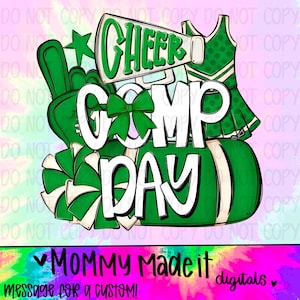 May include: A digital design with the words "CHEER COMP DAY" in white, outlined in black, with green accents. The design includes a megaphone, pom-poms, a star, and a cheerleader outfit. The text "MOMMY Made it digitals" is at the bottom.