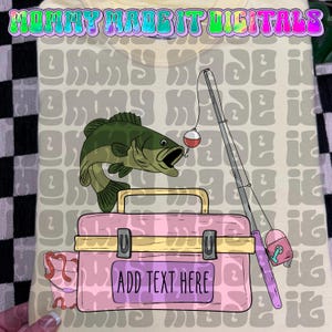 May include: A light yellow t-shirt featuring a cartoon illustration of a green fish, a pink tackle box, and a fishing rod. The tackle box has the text "ADD TEXT HERE". The top of the shirt has the text "MOMMY MADE IT DIGITALS".