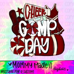 May include: A digital design with the words "CHEER COMP DAY" in white and red, featuring a megaphone, pom-poms, a star, and a cheerleader uniform. The design includes the text "MOMMY Made it digitals" at the bottom.