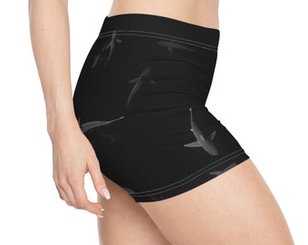 May include: Black athletic shorts with a white shark silhouette pattern.