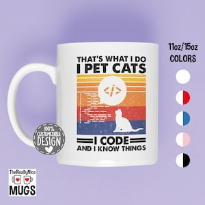 May include: White ceramic mug with a curved handle. The mug features the text "THAT'S WHAT I DO I PET CATS I CODE AND I KNOW THINGS" in black, with a retro-style design. The mug also has a cat silhouette and a coding symbol.