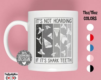 May include: White ceramic mug with a black and white illustration of shark teeth and the text "It's not hoarding if it's shark teeth". The mug is available in 11oz or 15oz sizes and in a variety of colors.