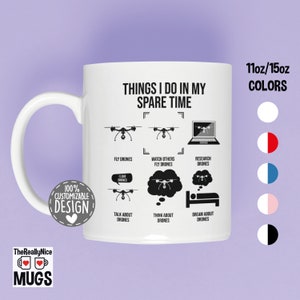 May include: White ceramic mug with a black design that says "Things I do in my spare time" and shows a list of activities related to drones. The mug is 11oz or 15oz and is available in multiple colors.